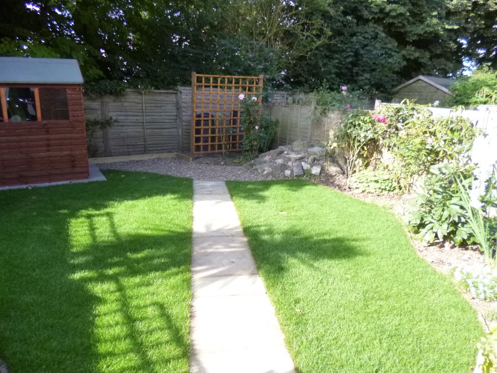 New path, new lawn and trellis to hide the bins