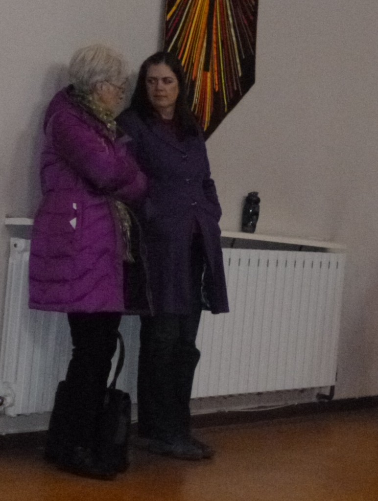 Ex-pupil and her mother warming themselves on the radiator