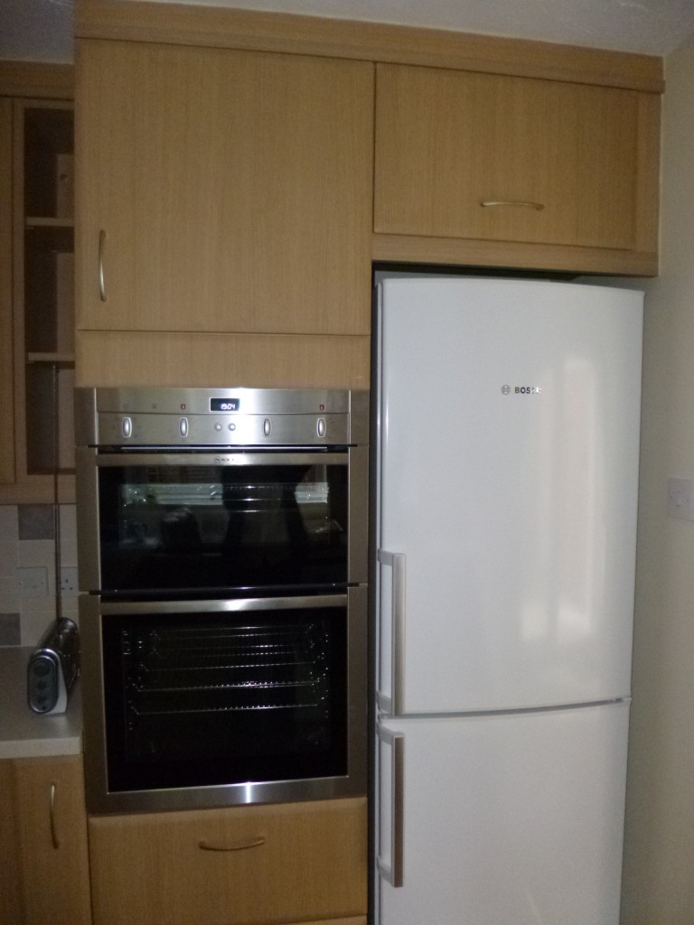 ......putting the fridge freezer in position.....